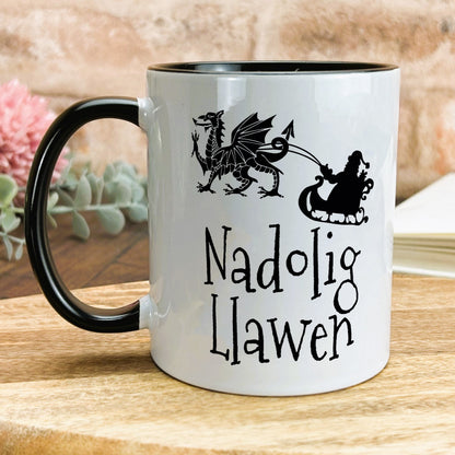 a black and white coffee mug with a dragon and a dragon on it