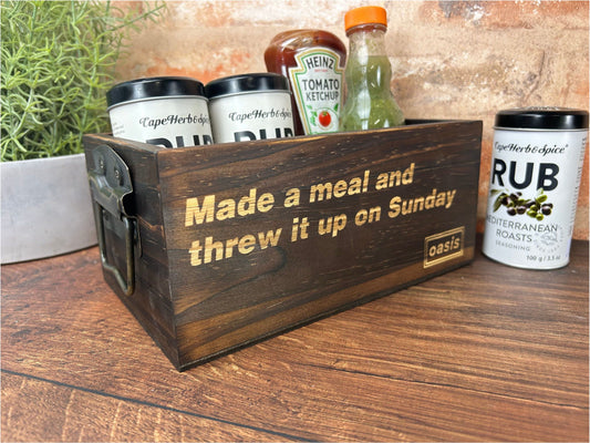 a wooden box with a sign that says made a meal and threw it up on