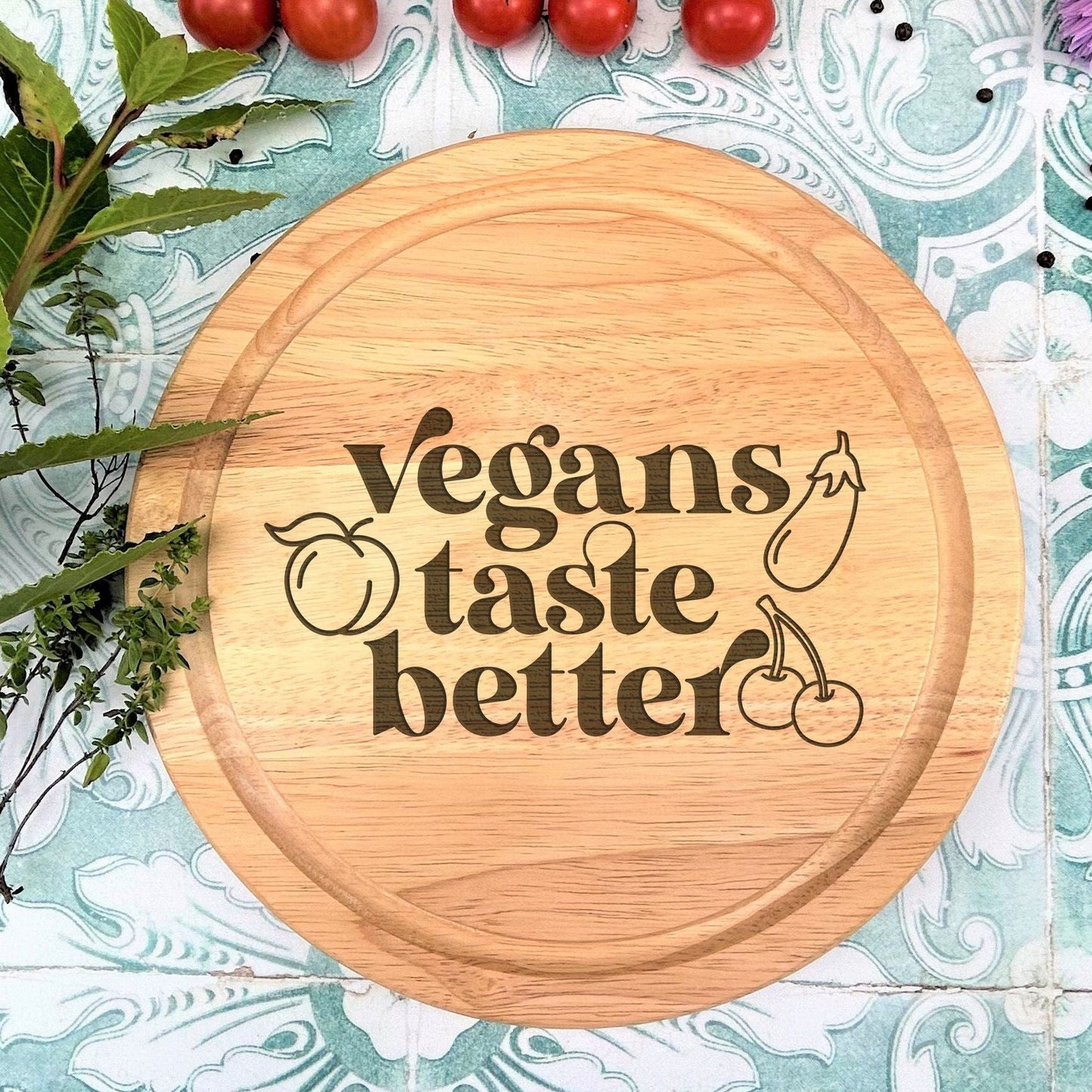 a cutting board with the words vegans taste better on it