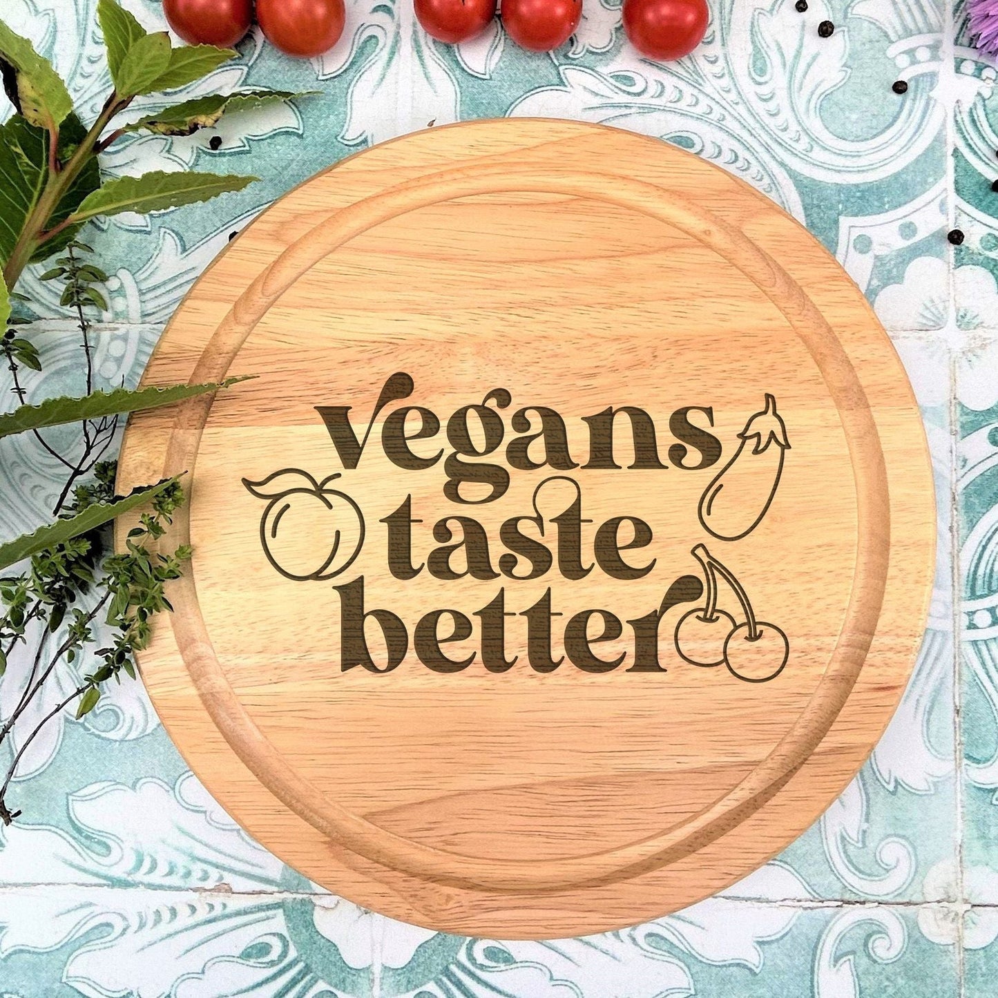 a cutting board with the words vegans taste better on it