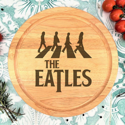 a cutting board with the words the beatles on it