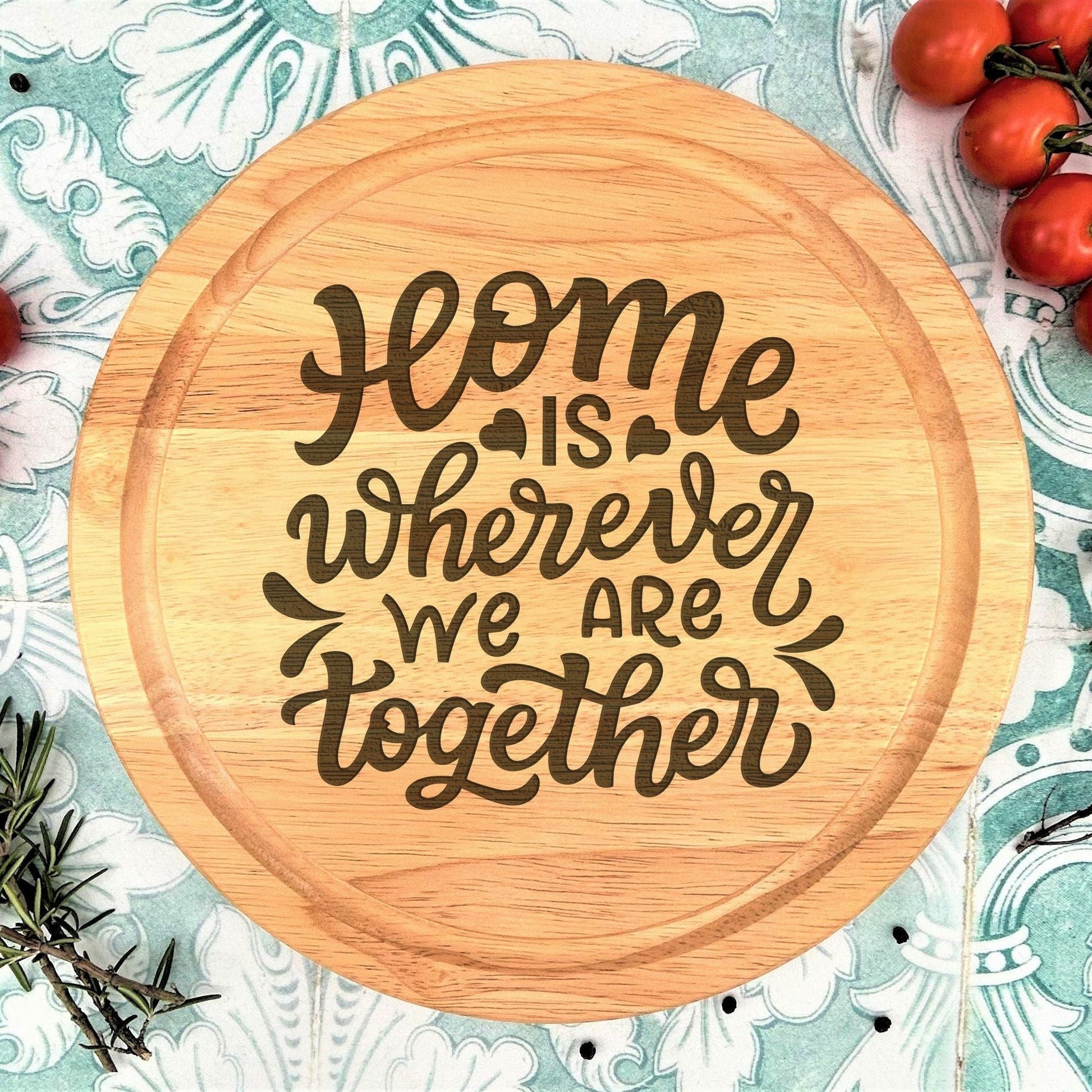 a wooden cutting board with some tomatoes on it