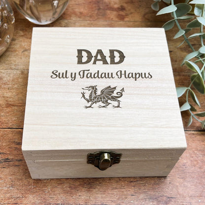 a wooden box sitting on top of a wooden table