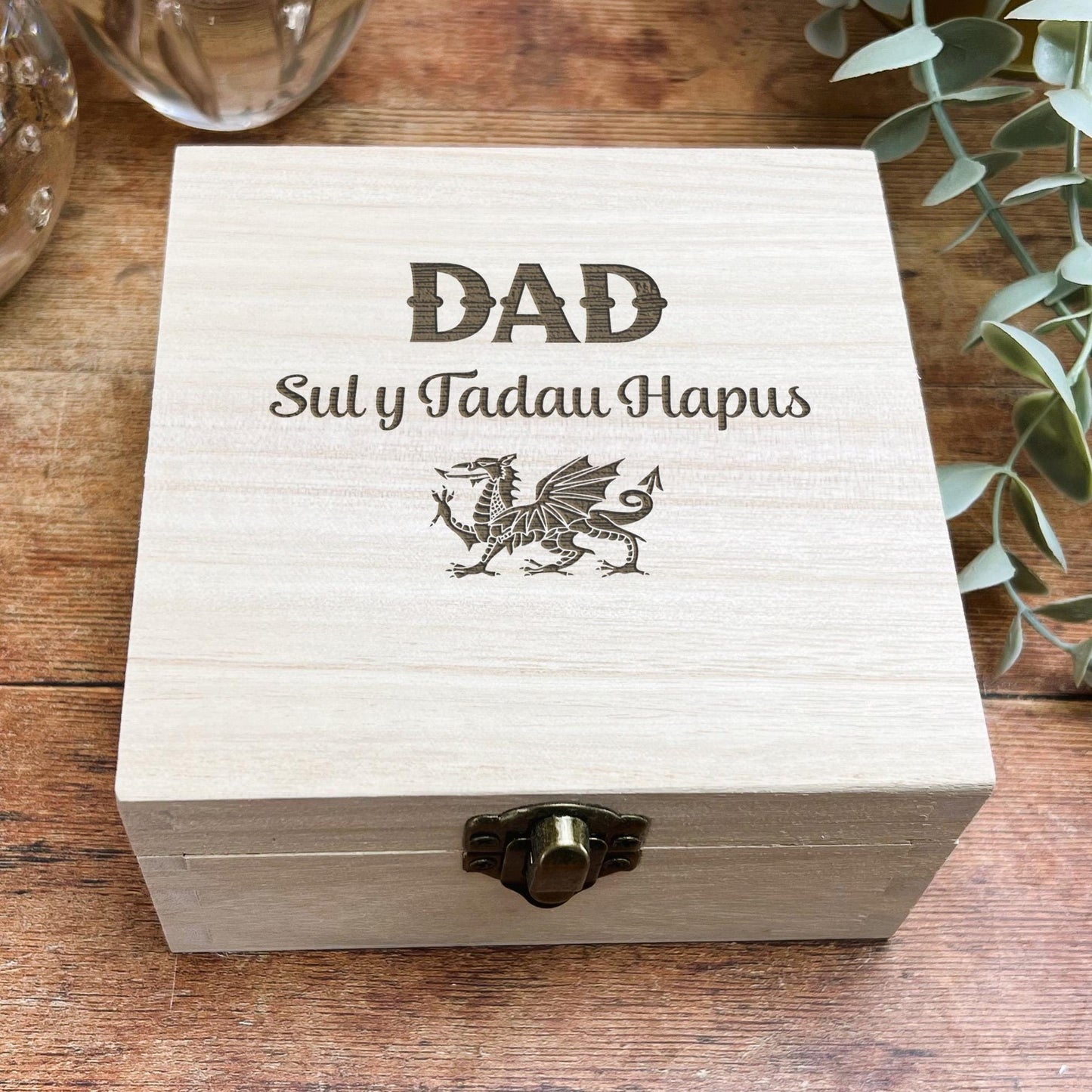 a wooden box sitting on top of a wooden table