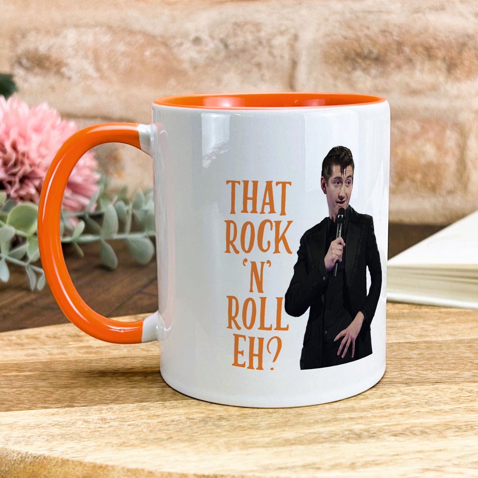 a coffee mug with a picture of a man holding a microphone