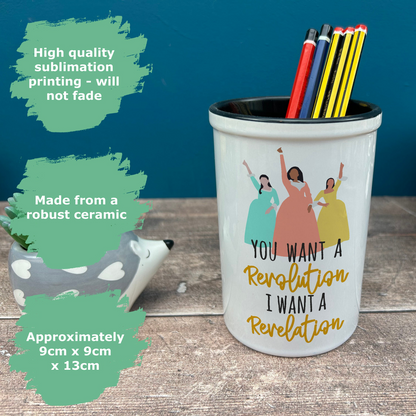 a cup that has some pencils in it