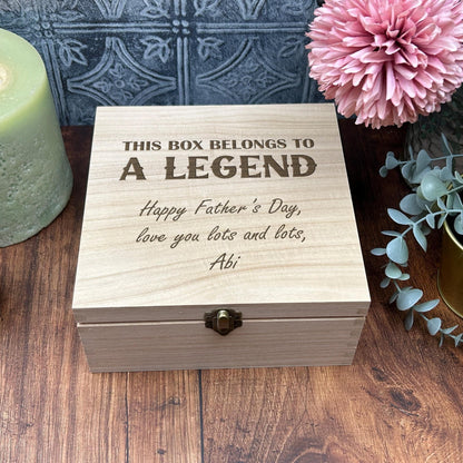 a wooden box sitting on top of a wooden table