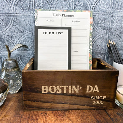 a wooden box sitting on top of a wooden table