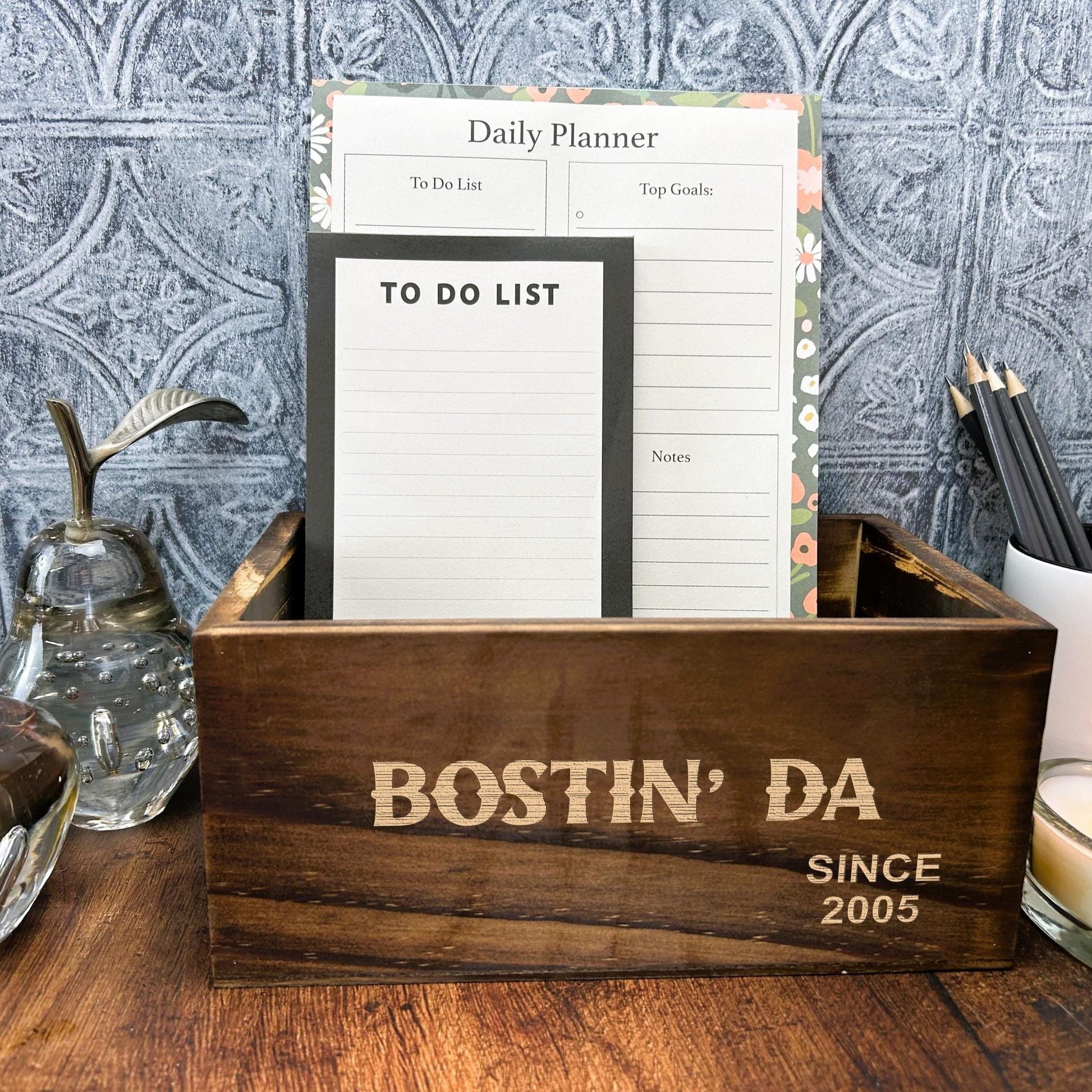 a wooden box sitting on top of a wooden table