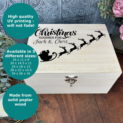 a wooden box with a picture of a santa's sleigh on it