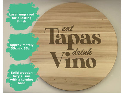 a wooden sign that says eat tapas drink vino