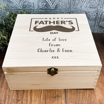 a wooden box with a picture of a mustache on it