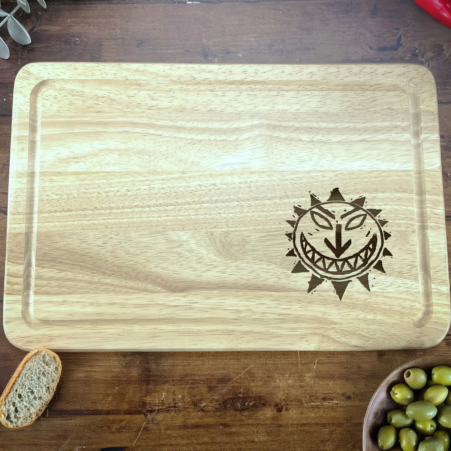 a wooden cutting board with a picture of an owl on it