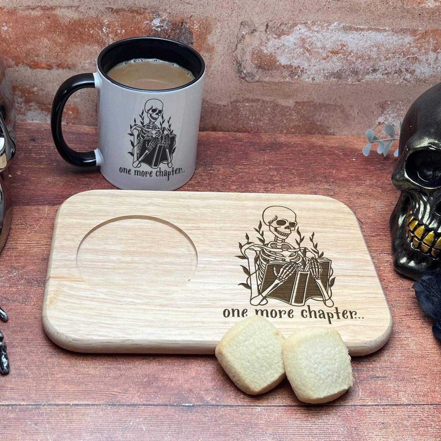 a wooden cutting board topped with a skull next to a cup of coffee