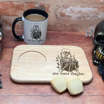 a wooden cutting board topped with a skull next to a cup of coffee