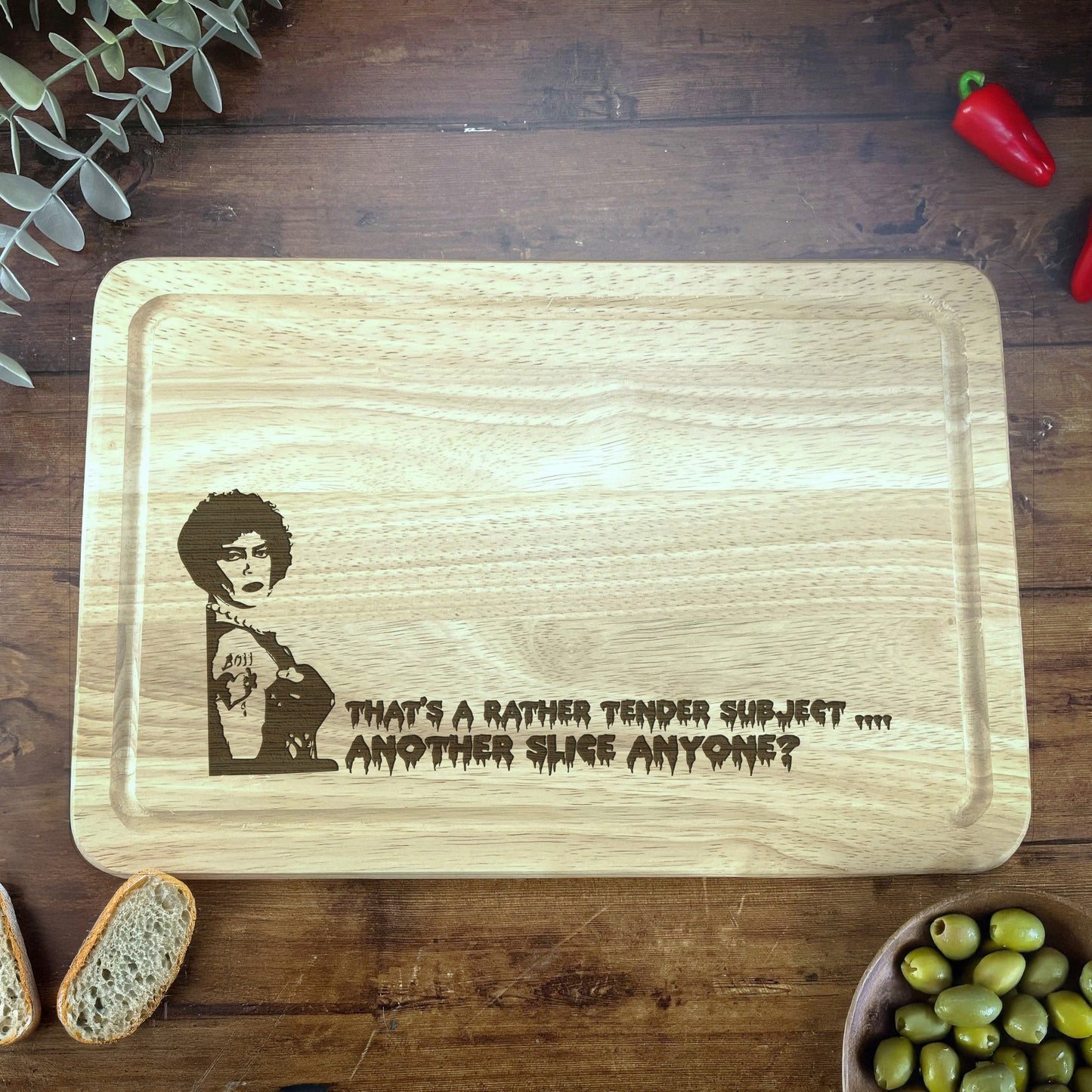 a wooden cutting board with a picture of a woman on it