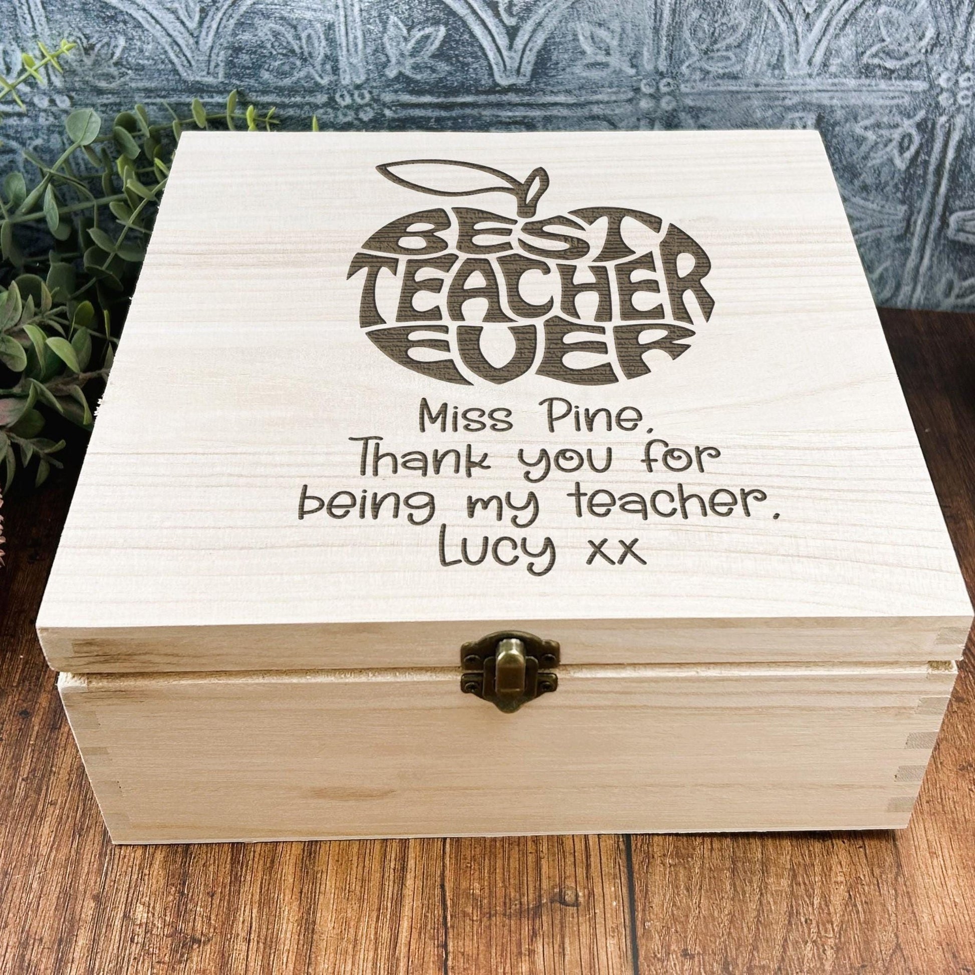 a wooden box sitting on top of a wooden table