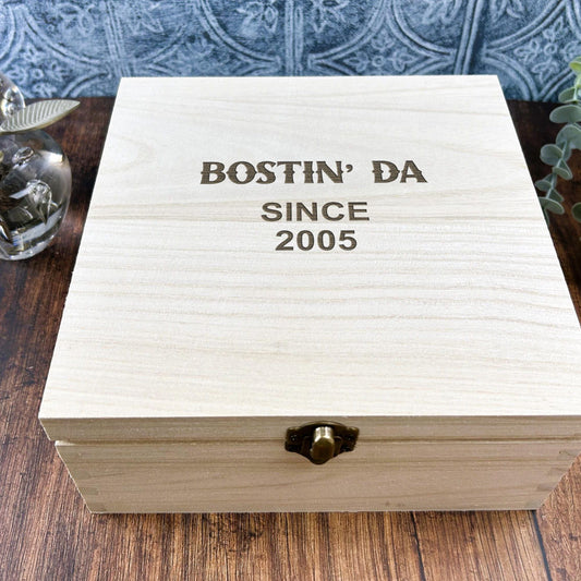a wooden box sitting on top of a wooden table