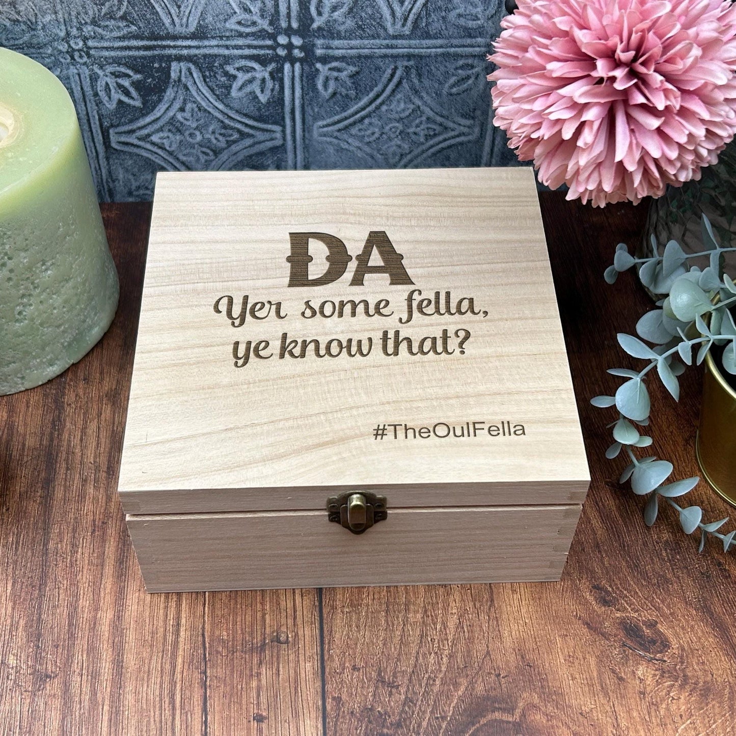 a wooden box sitting on top of a wooden table