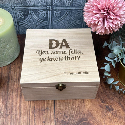 a wooden box sitting on top of a wooden table