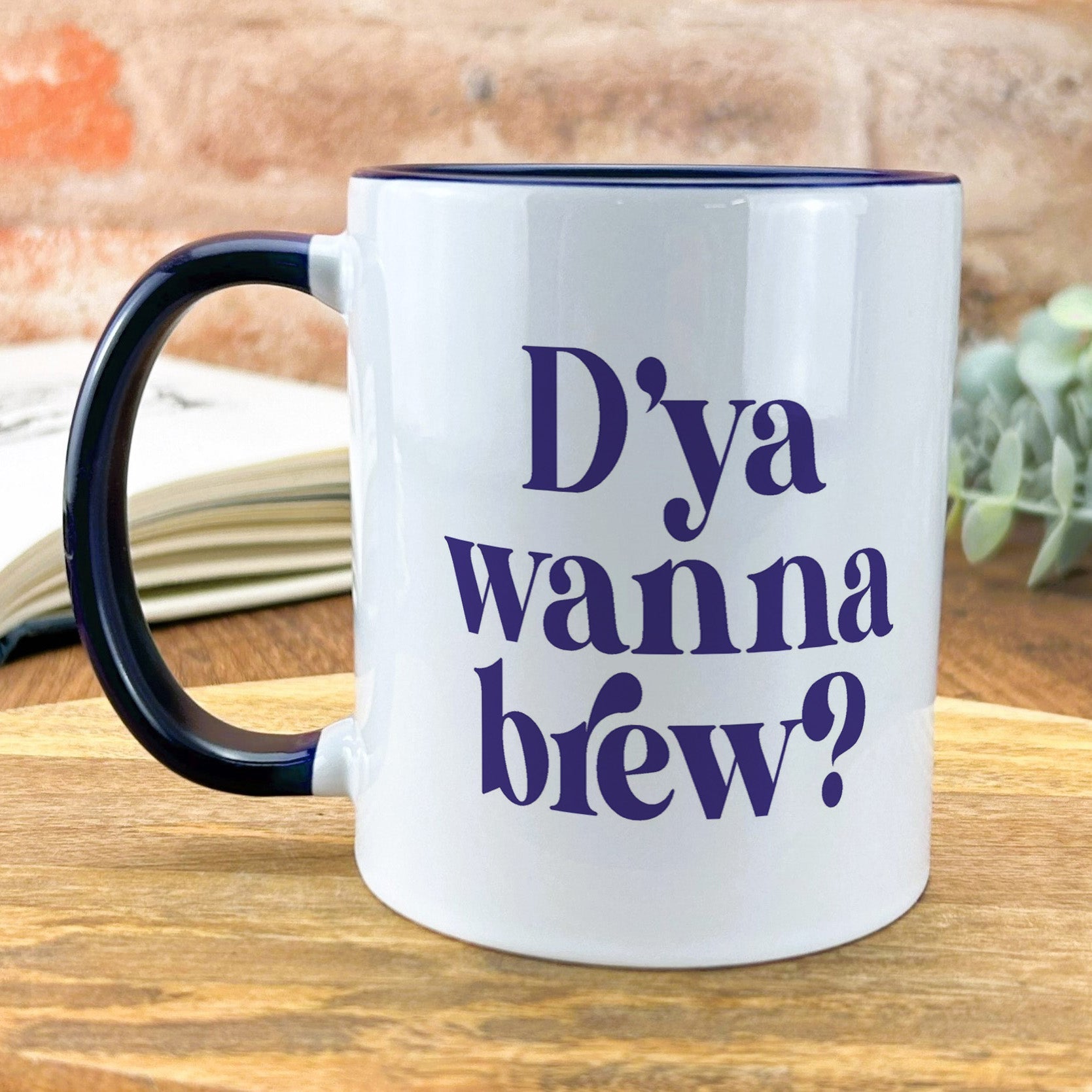 a black and white coffee mug with the words dya wanna brew? on it