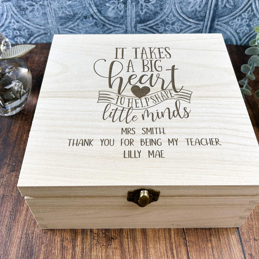 a wooden box sitting on top of a wooden table