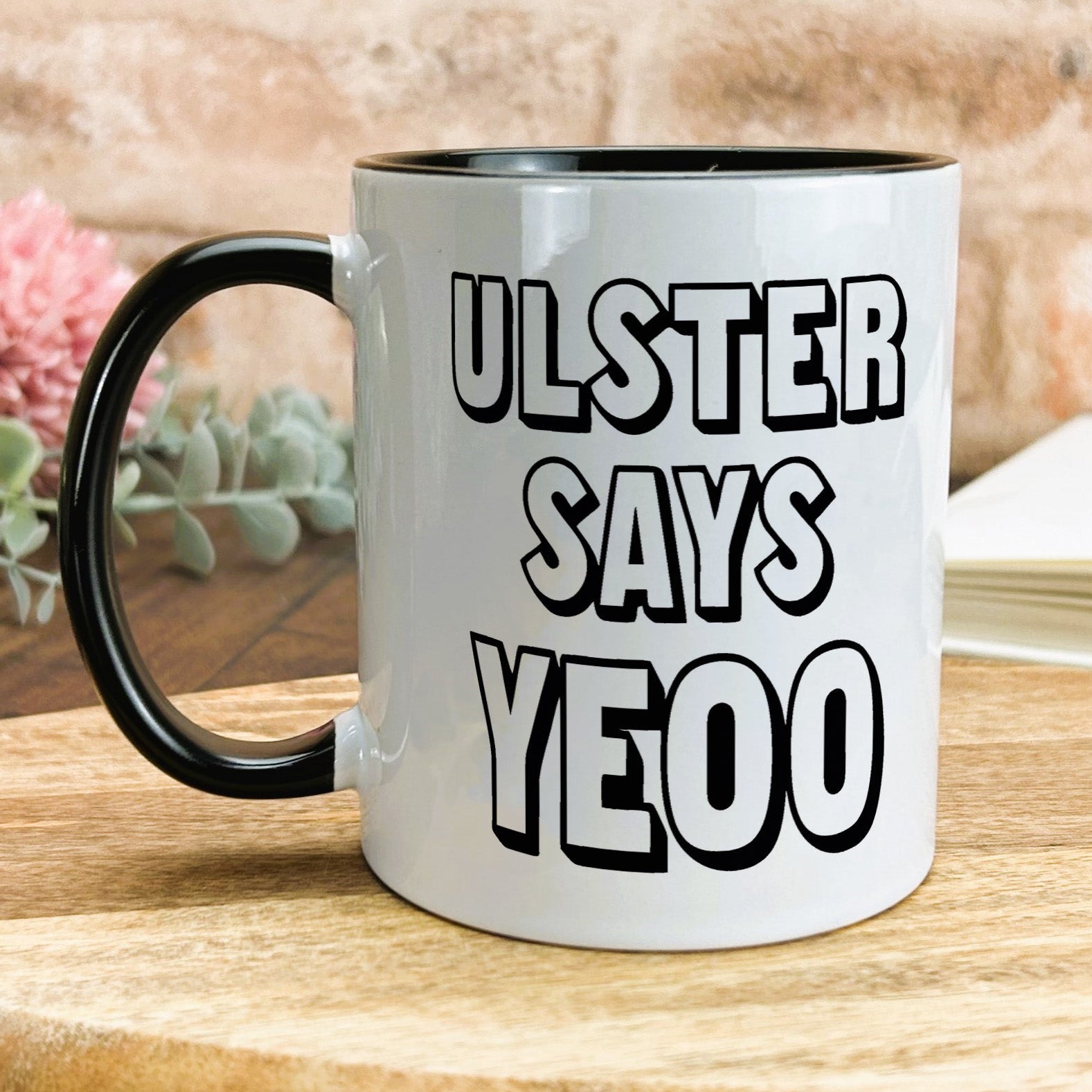 a black and white coffee mug with the words u -ster says yeoo on