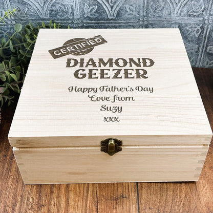 a wooden box sitting on top of a wooden table