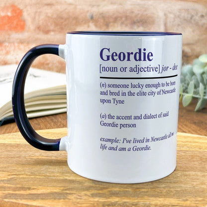 a mug with a poem on it sitting on a table
