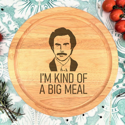 a wooden cutting board with a picture of a man on it