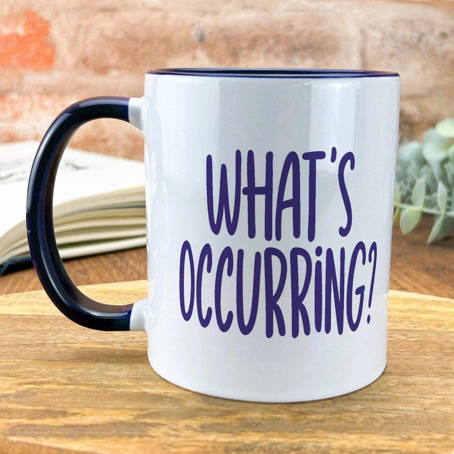 a black and white coffee mug that says what's occurring?
