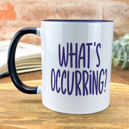 a black and white coffee mug that says what's occurring?