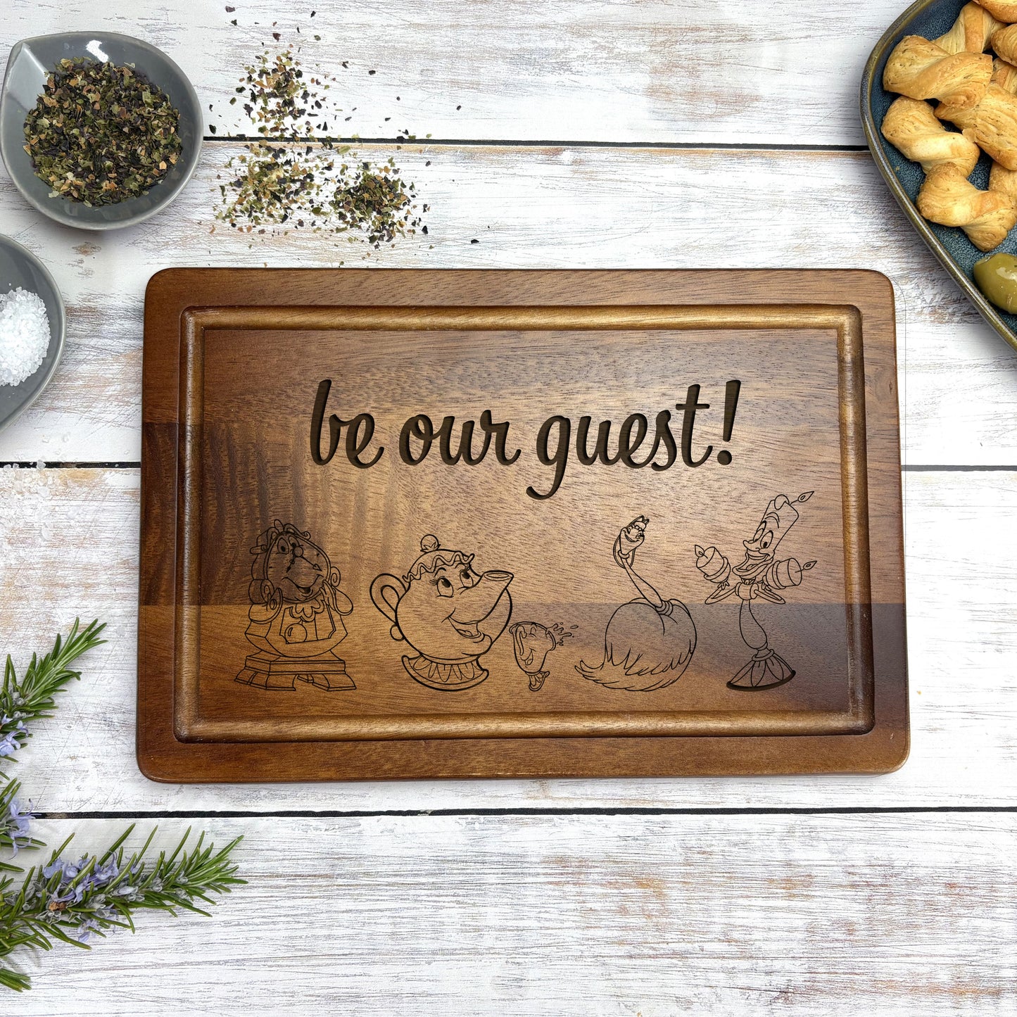 a wooden sign that says be our guest