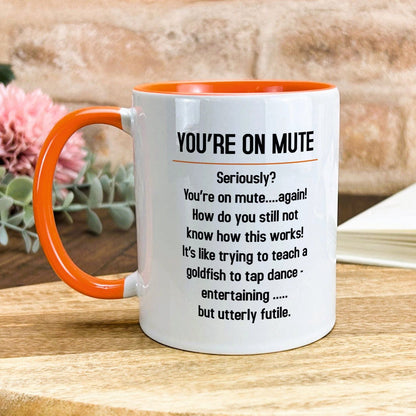 a white and orange coffee mug with a poem on it