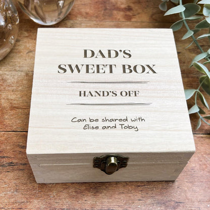 a wooden box sitting on top of a wooden table