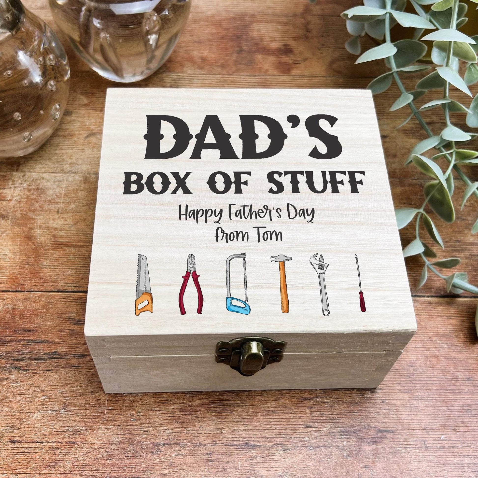 a father's box of stuff on a wooden table