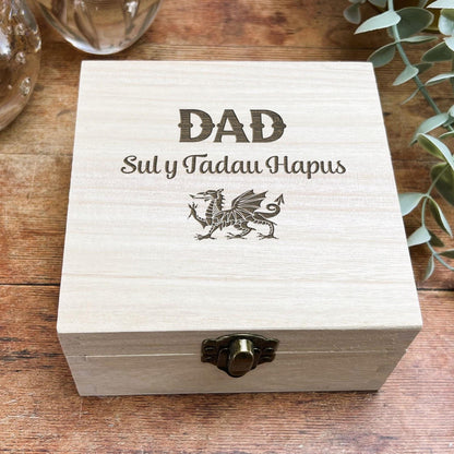 a wooden box sitting on top of a wooden table