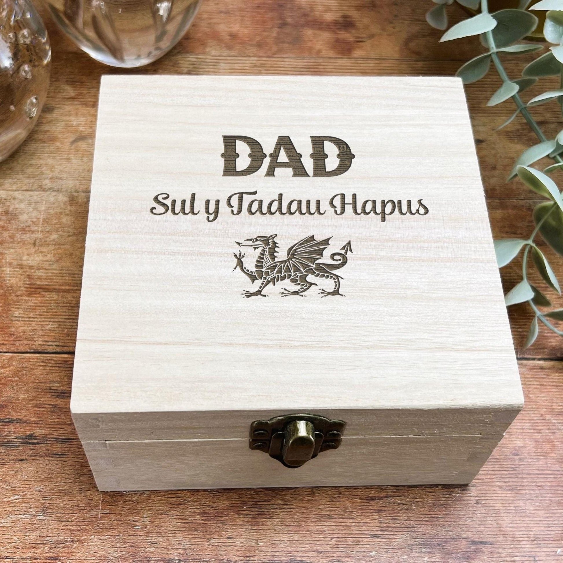 a wooden box sitting on top of a wooden table