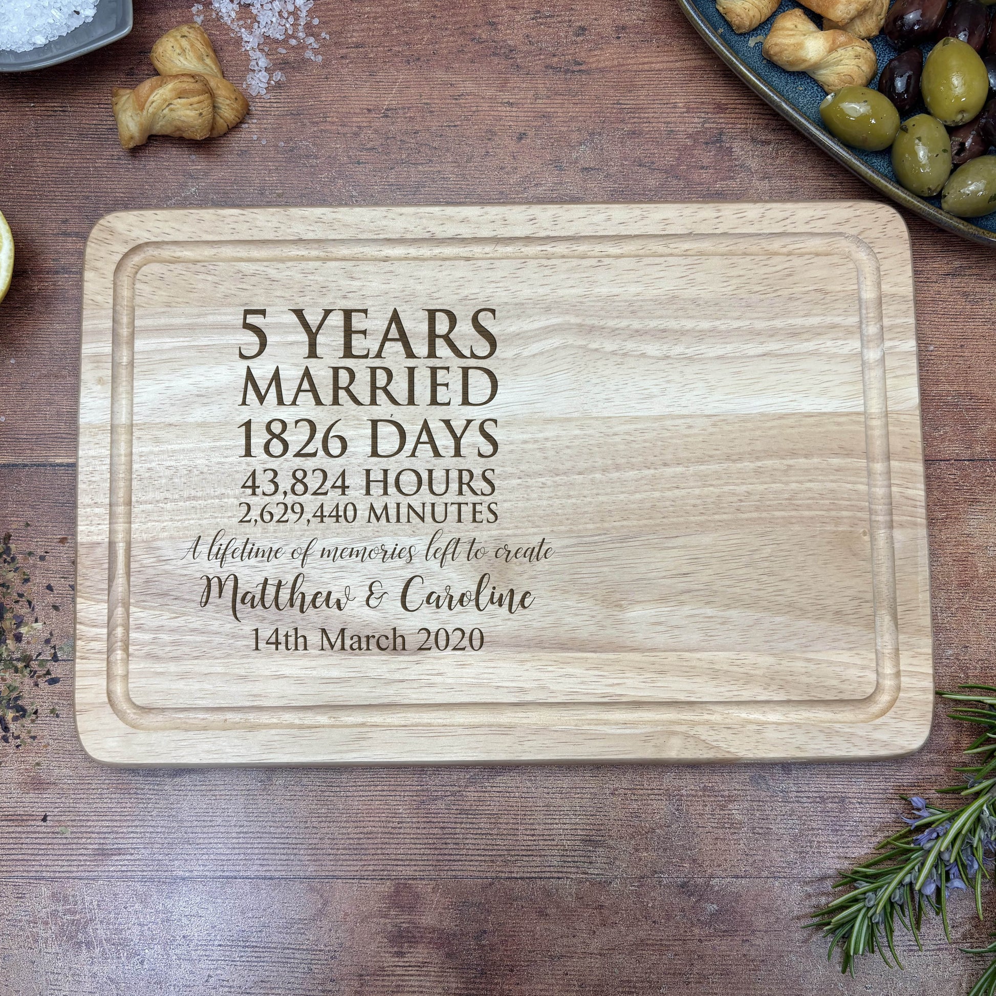 a wooden cutting board with a date printed on it