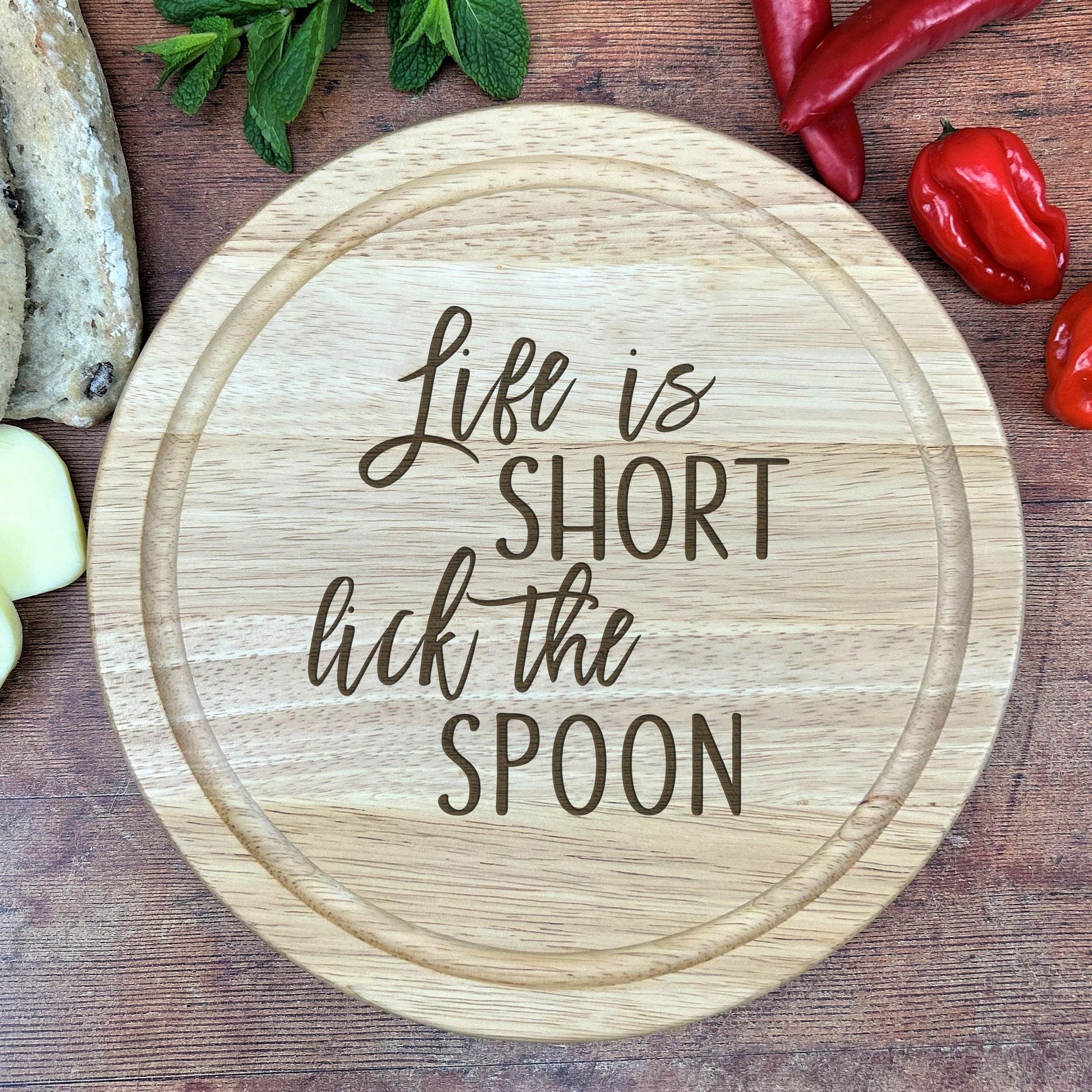a wooden cutting board with a quote on it