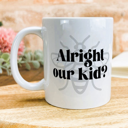 a white coffee mug sitting on top of a wooden table
