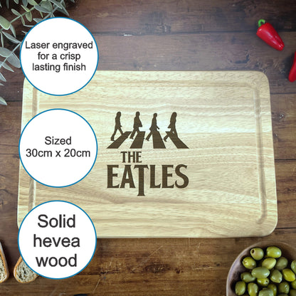 a cutting board with the words the beatles on it