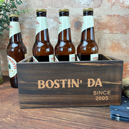 a wooden box filled with bottles of beer