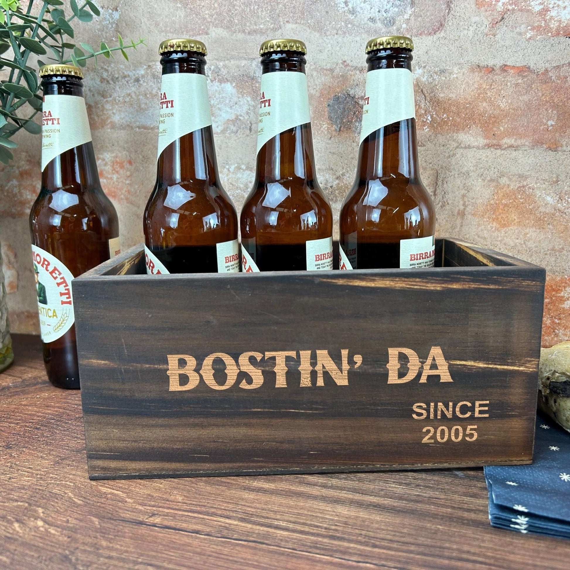 a wooden box filled with bottles of beer