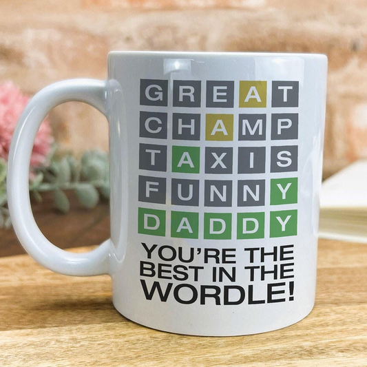 A white ceramic mug with a message printed on it.