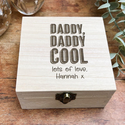 a wooden box sitting on top of a wooden table