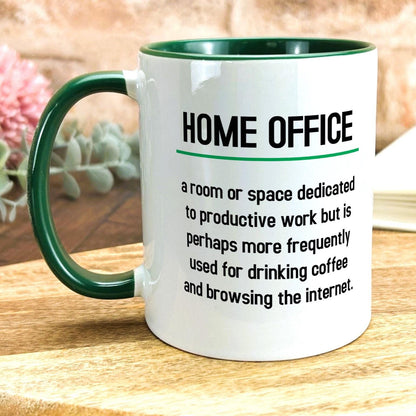 a green and white coffee mug sitting on top of a wooden table