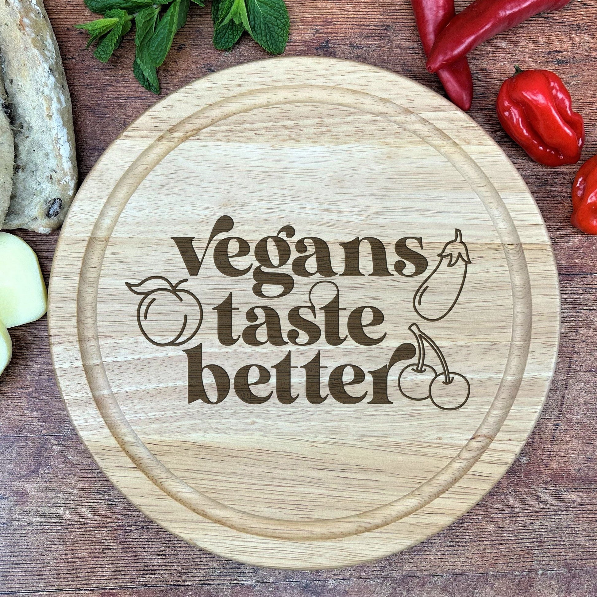 a cutting board with the words vegans taste better on it