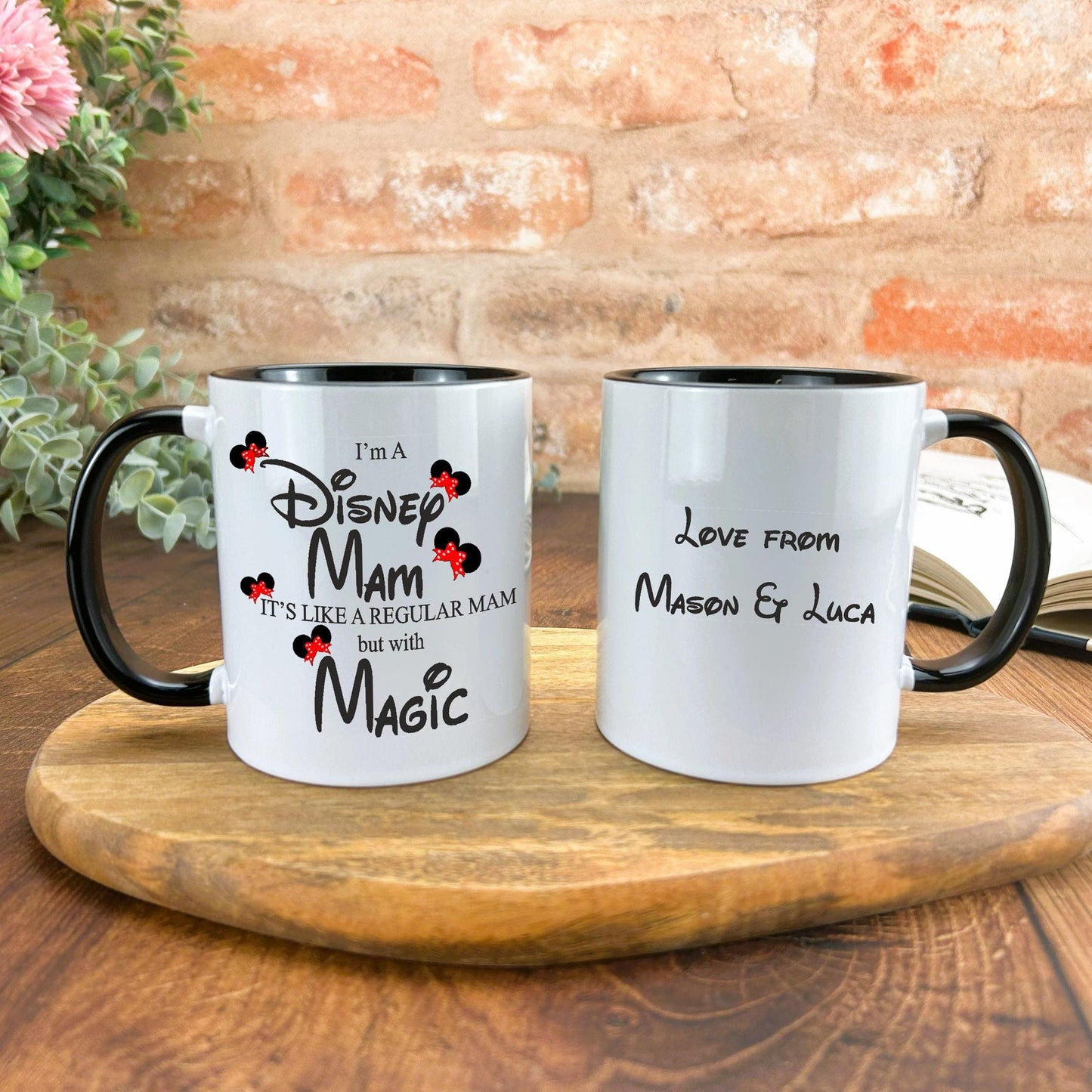 a couple of coffee mugs sitting on top of a wooden table