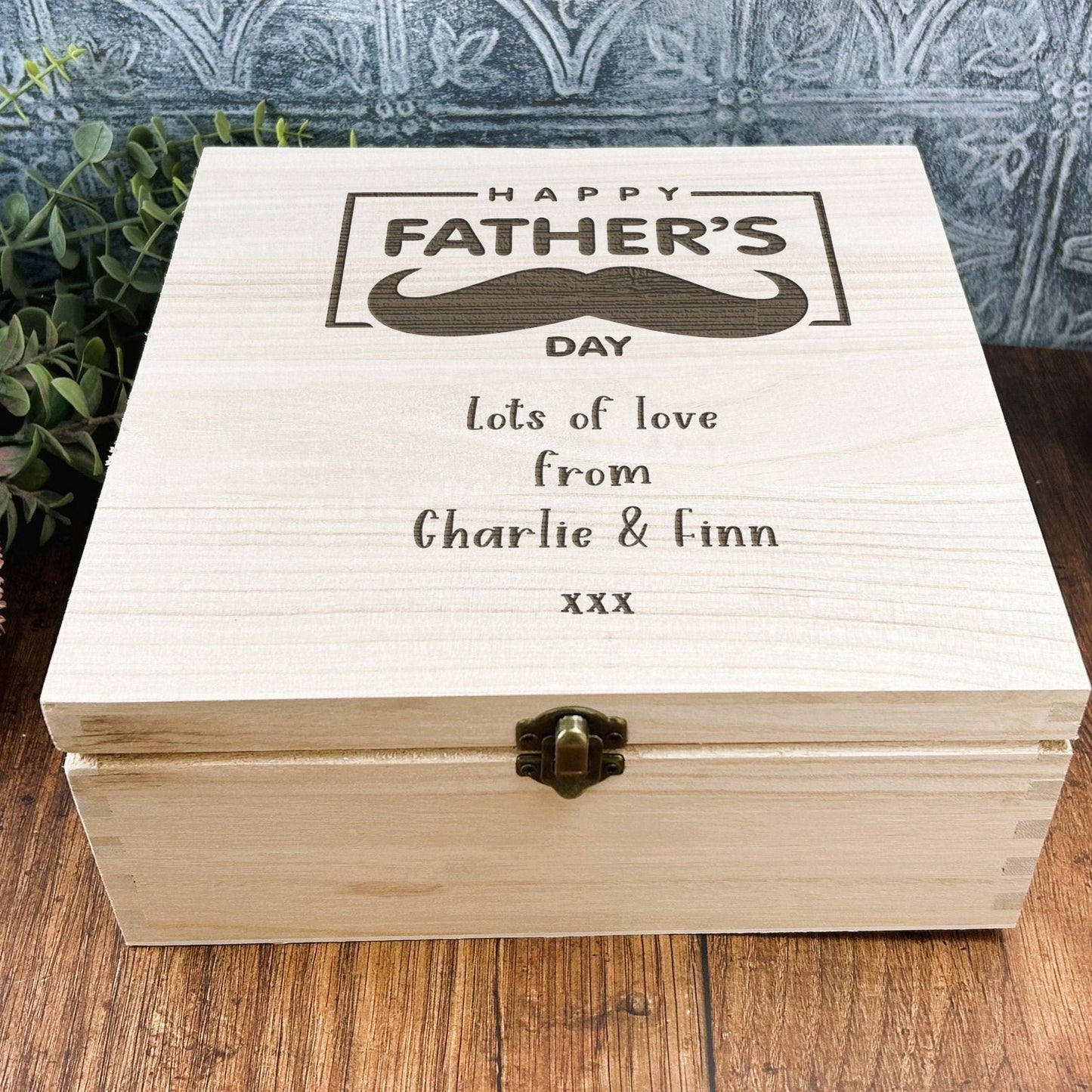 a wooden box sitting on top of a wooden table